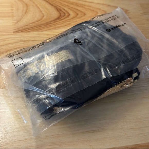 NWT Lululemon Dual Pouch Wristlet Black Gold Wordmark NWT - Picture 6 of 7